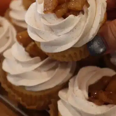 Apple pie cupcakes topped with cinnamon and apple slices