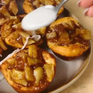 Cinnamon Roll Apple Pie 2 Cinnamon roll apple pie with a flaky crust and cinnamon swirl topping