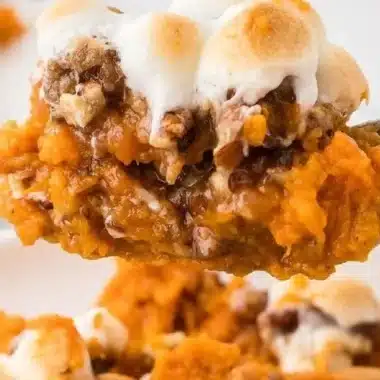 Sweet Potato Casserole 2 Delicious homemade sweet potato casserole topped with marshmallows and pecans.