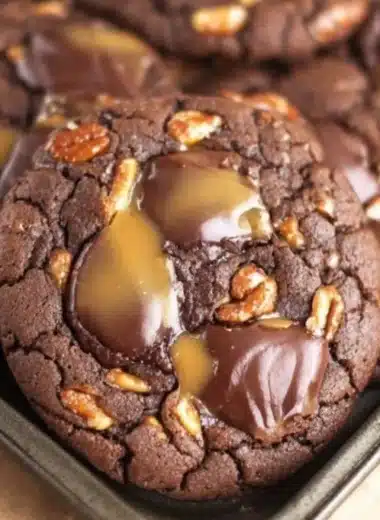 Plate of homemade turtle cookies with chocolate, caramel, and pecans