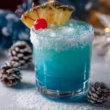 Jack Frost Cocktail garnished with mint and served in a chilled glass