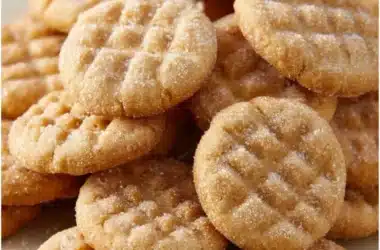 Melt-in-your-mouth sugar cookies on a plate, decorated with sprinkles